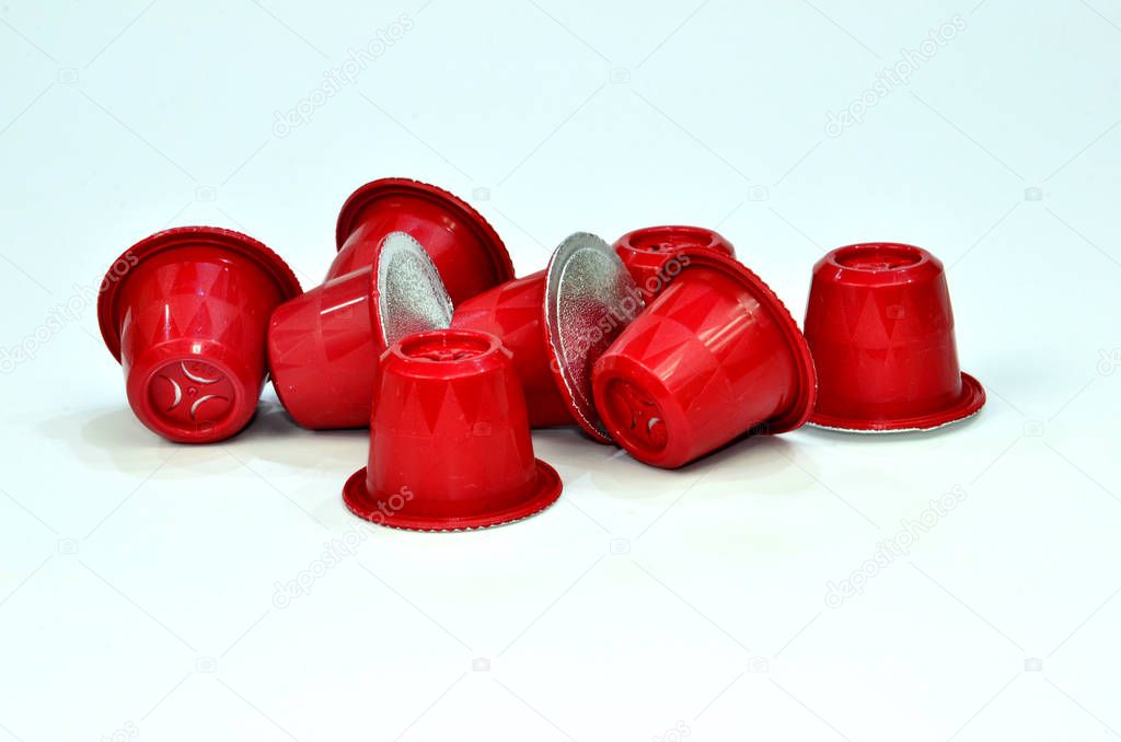 Collection of espresso coffee capsules red isolated on white background, Closeup view with details.