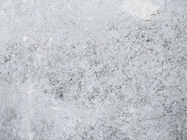 Textur einer grauen Betonwand aus kleinen Krümeln — Stockfoto