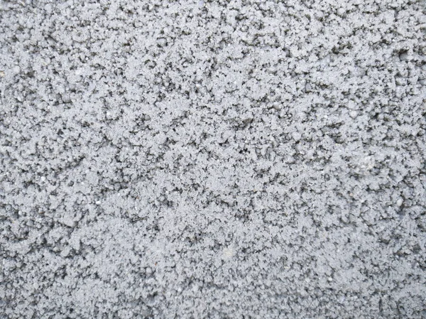 Texture of a gray concrete wall scatter of small crumbs — Stock Photo, Image