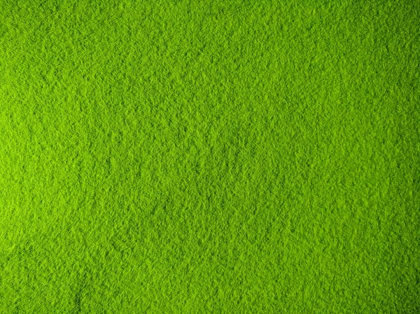 Texture of homogeneous felt, plain green fabric background — Stock Photo, Image