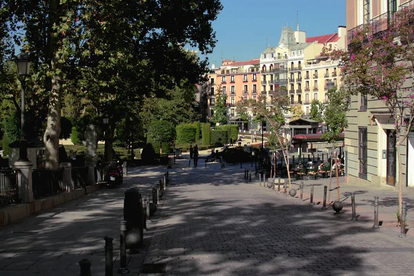 Walking through the empty streets of Madrid in the park and the monument to the Monument to Philip IV near the Royal Palace of Madrid.