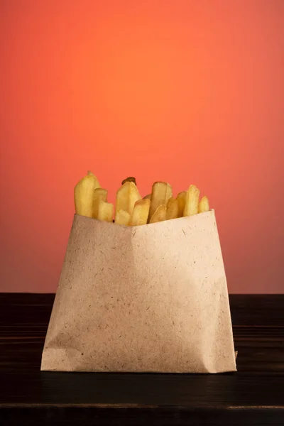 Fried potato sticks in a craft bag