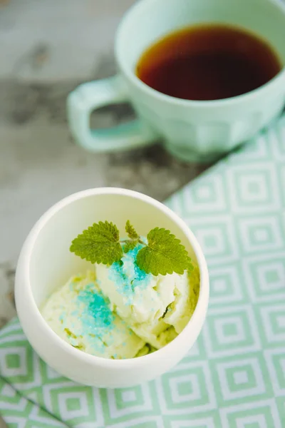 Homemade mint ice cream in white ice cream bowl