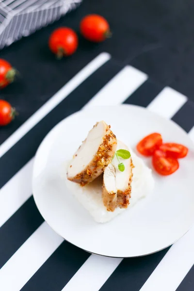 Chicken fillet with rice and tomatoes
