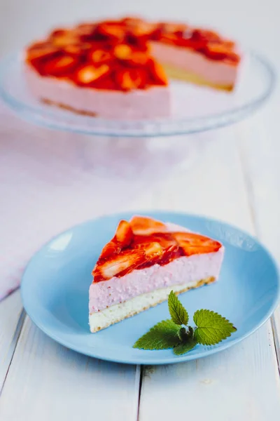 Homemade strawberry mousse cake with mint