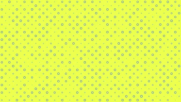 Синие круги на желтом фоне изменяются по размеру при движении сверху — стоковое видео