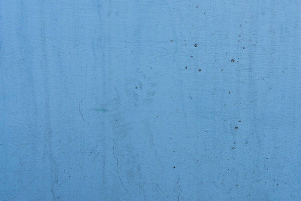 close-up view of old blue scratched wall texture