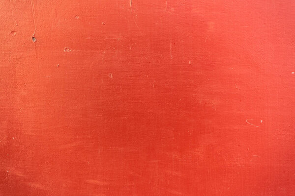 close-up view of bright red scratched textured background