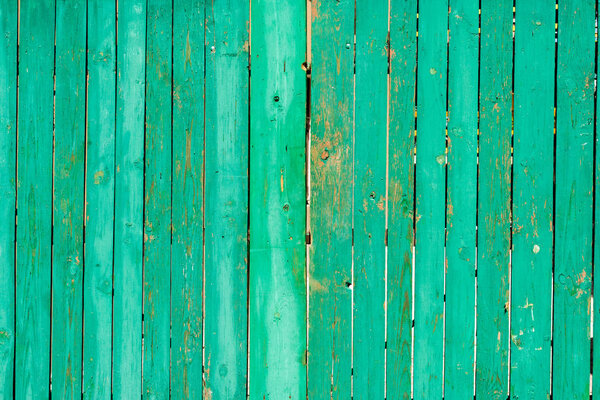 old scratched green wooden fence background