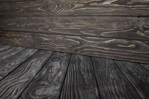 dark grey wooden floor and dark brown wooden wall