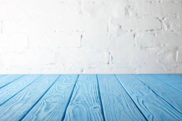 Light Blue Wooden Tabletop White Wall Bricks — Stock Photo, Image