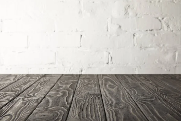 Dark Grey Wooden Tabletop White Wall Bricks — Stock Photo, Image