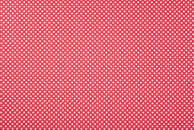 Texture of polka dot pattern on red background clipart