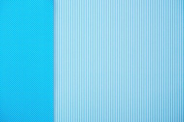 Abstract background with blue striped and polka dot patterns clipart