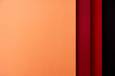 Kağıt yapraklarının kırmızı ve turuncu tonlarında ile arka plan