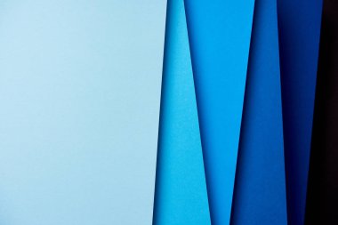 Abstract background with paper sheets in blue tones clipart