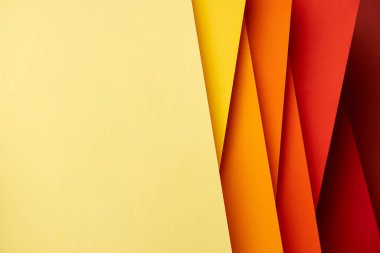 Pattern of overlapping paper sheets in red and yellow tones