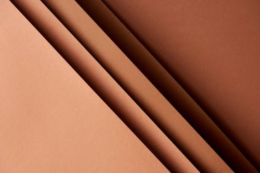 Pattern of overlapping paper sheets in brown tones clipart