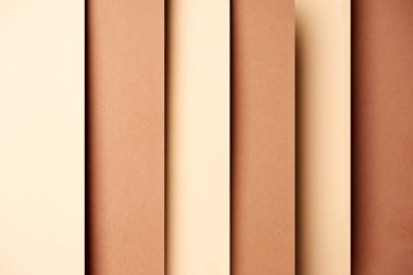 Abstract background with paper sheets in beige and brown tones clipart