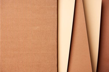 Paper sheets in beige and brown tones background clipart