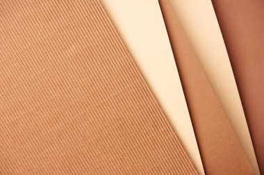 Pattern of diagonal paper sheets in beige and brown tones clipart