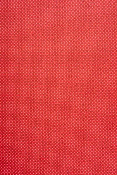 Small polka dot pattern on red background