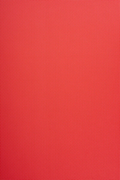 Small polka dot pattern on red background