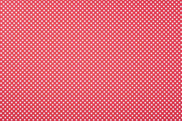 Texture of polka dot pattern on red background