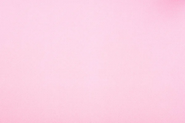Texture of polka dot pattern on pink background