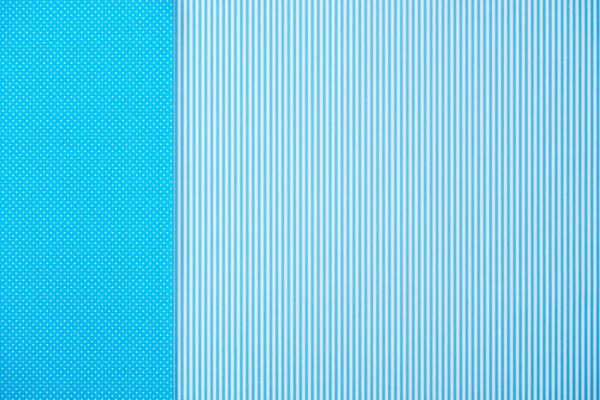 Abstract background with blue striped and polka dot patterns