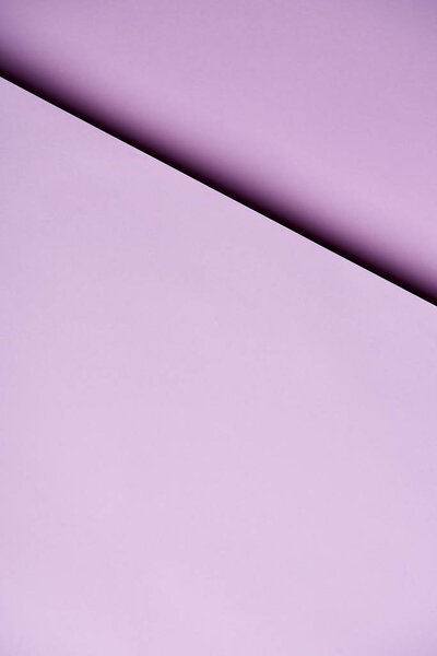 Paper sheets in light purple tones background
