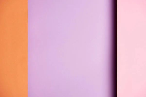 紫とオレンジ色の紙用紙が重なって給紙のパターン — ストック写真