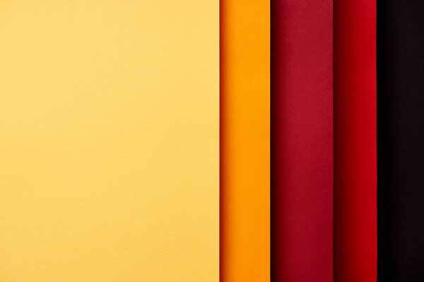 Pattern of overlapping paper sheets in red and yellow tones