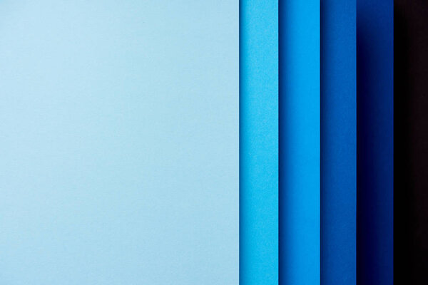 Pattern of vertical overlapping paper sheets in blue  tones
