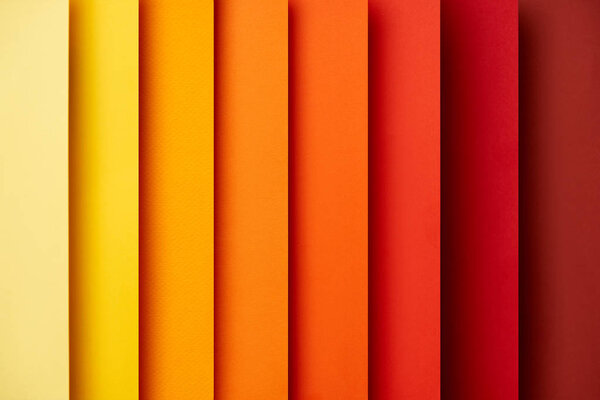 Abstract background with vertical paper sheets in red and yellow tones