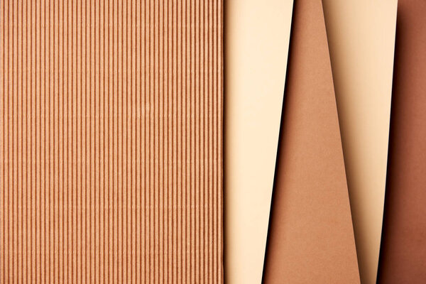 Paper sheets in beige and brown tones background