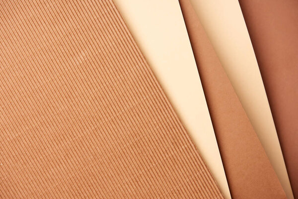 Pattern of diagonal paper sheets in beige and brown tones