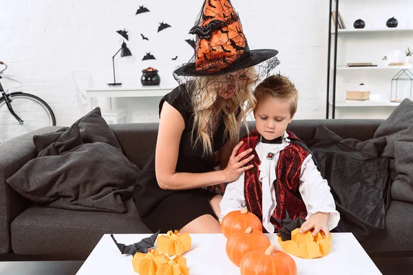 Portrait Mother Son Halloween Costumes Sitting Coffee Table Pumpkins Home — Free Stock Photo