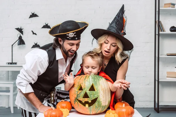 Portrait Parents Son Halloween Costumes Looking Pumpkin Together Home — Stock Photo, Image