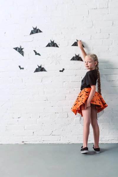 Back View Child Skirt Hanging Black Paper Bats White Brick — Stock Photo, Image