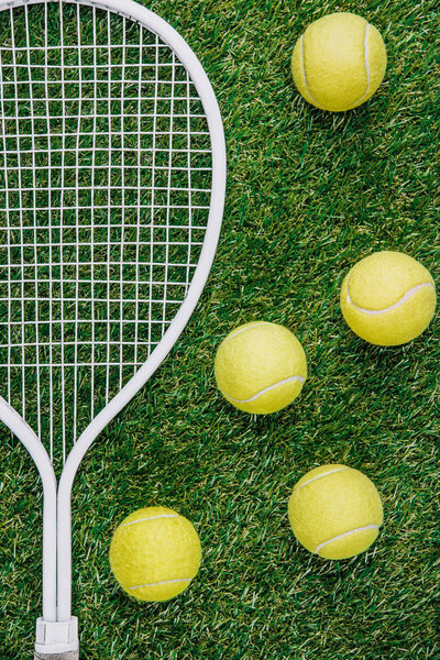 top view of tennis equipment of green grass