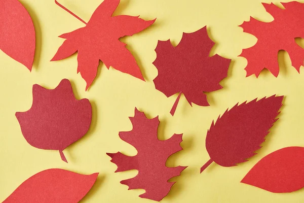 Full Frame Red Handcrafted Paper Leaves Yellow Background — Free Stock Photo