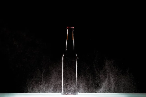 Beer Bottle Spraying Water Surface Black Background — Stock Photo, Image