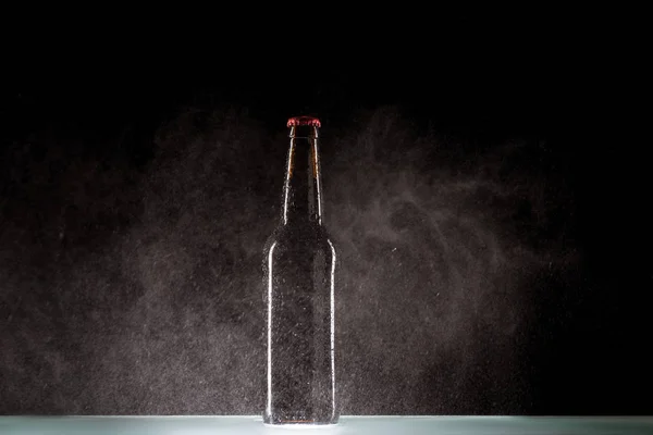 Beer Bottle Spraying Water Surface Black Background — Stock Photo, Image