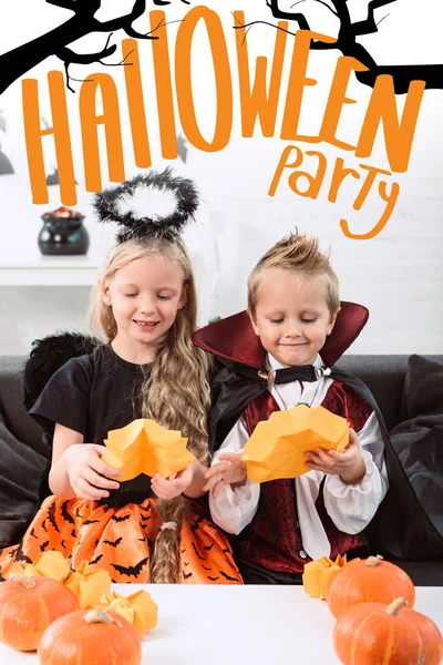 Portrait Little Siblings Halloween Costumes Sitting Sofa Table Pumpkins Home — Stock Photo, Image