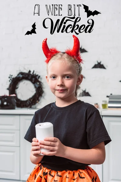 Portrait Little Kid Red Devil Horns Holding Candle Hands Home — Free Stock Photo