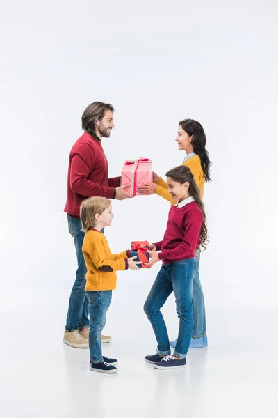 Smiling Parents Kids Presenting Wrapped Gifts Each Other Isolated White — Stock Photo, Image