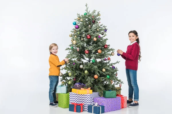 Smiling Siblings Decorating Christmas Tree Presents Isolated White — Stock Photo, Image