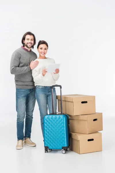 Couple Using Digital Tablet Standing Suitcase Carton Boxes Looking Camera — Stock Photo, Image