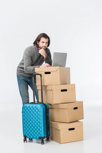 Pensive Man Using Laptop Cardboard Boxes Isolated White — Stock Photo, Image